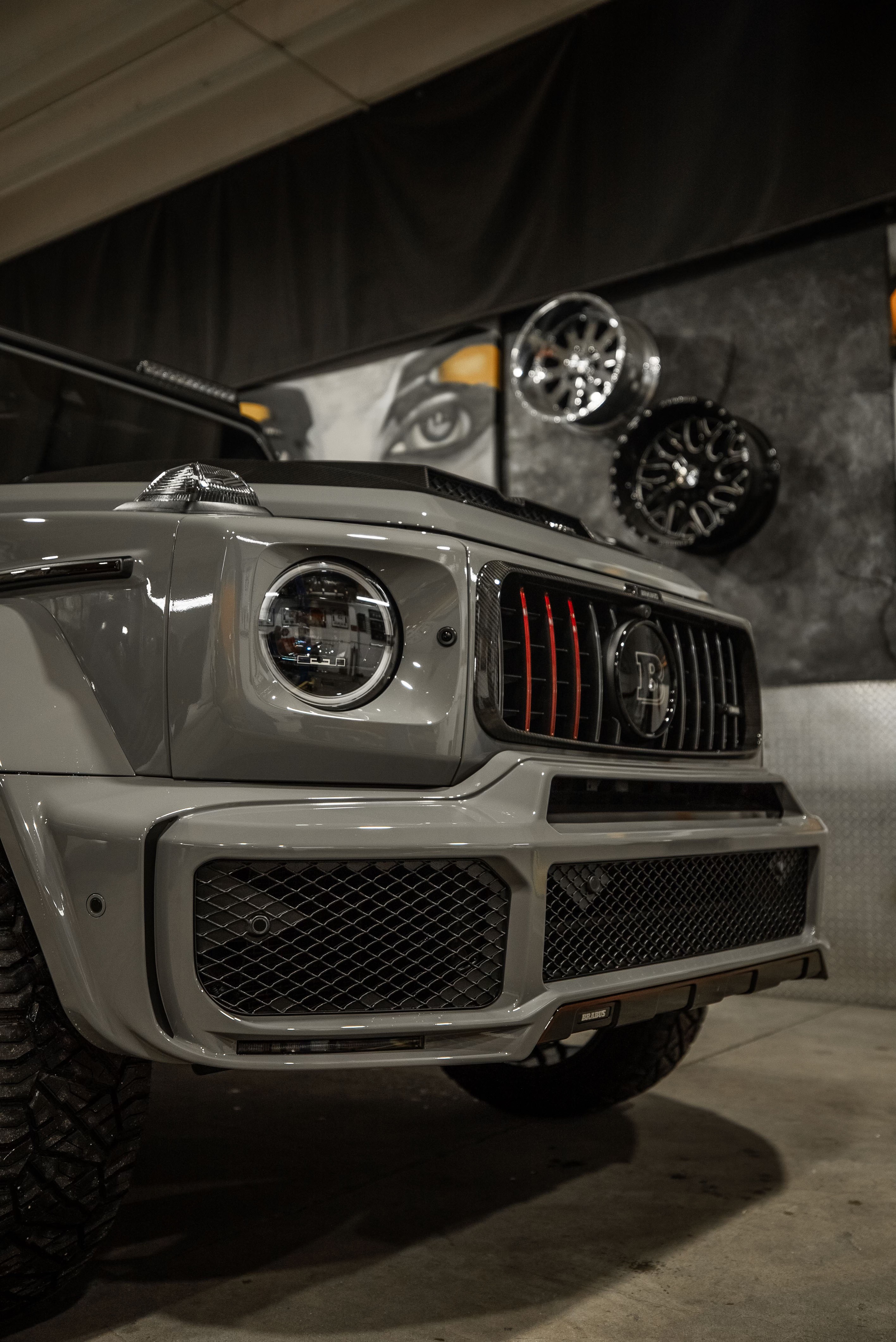 Brabus-widebody Mercedes-AMG G 63 in nardo grey inside a studio garage
